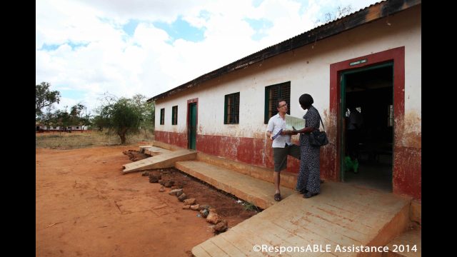 A ResponsABLE Assistance representative talks to one school’s Special Needs Coordinator. Concrete ramps are clearly visible to allow wheelchair access into the classrooms