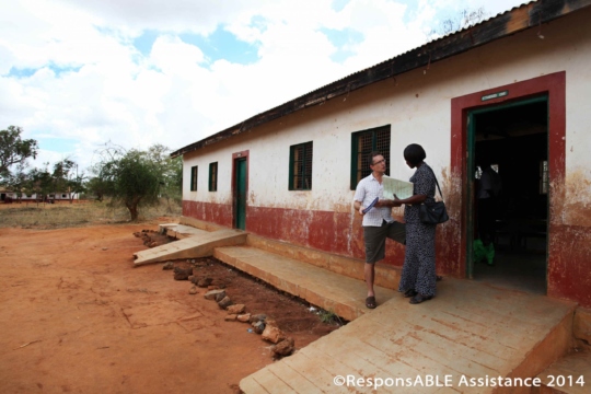 A ResponsABLE Assistance representative talks to one school’s Special Needs Coordinator. Concrete ramps are clearly visible to allow wheelchair access into the classrooms