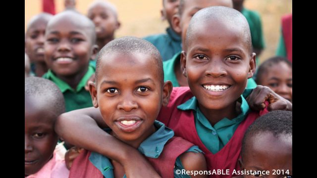 The warm welcome was particularly special in the schools we visited to learn what sort of experiences their disabled students have. Two of the student girls at one particular school smile as they have their picture taken