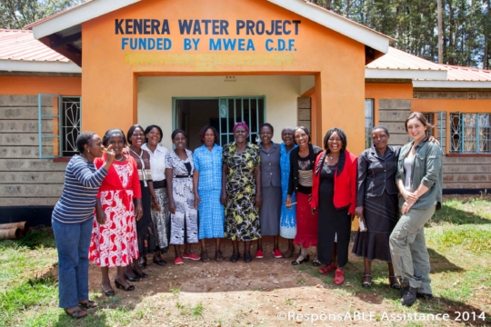 A group of ladies who manage the highly impressive and successful Kenera Water Project all smile for the camera at the entrance to their office