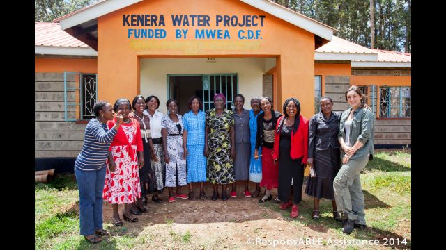 A group of ladies who manage the highly impressive and successful Kenera Water Project all smile for the camera at the entrance to their office