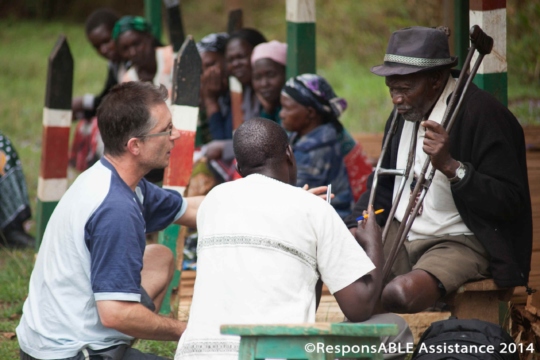 We talk to an older gentleman who uses crutches and looks immaculate in his white shirt, black jacket & grey hat