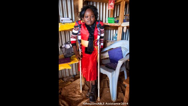 Rebecca, who uses crutches and a raised shoe, shows us her tiny sweet shop