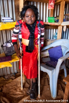 Rebecca, who uses crutches and a raised shoe, shows us her tiny sweet shop