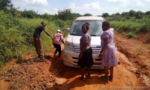 The car is too low and is now stuck in the ground. On the way to Itangini Fursa group for business skills training.